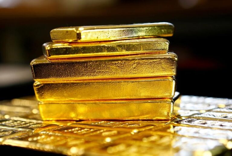 Gold prices decrease as rate cut hopes dwindle, reducing weekly gains slightly.