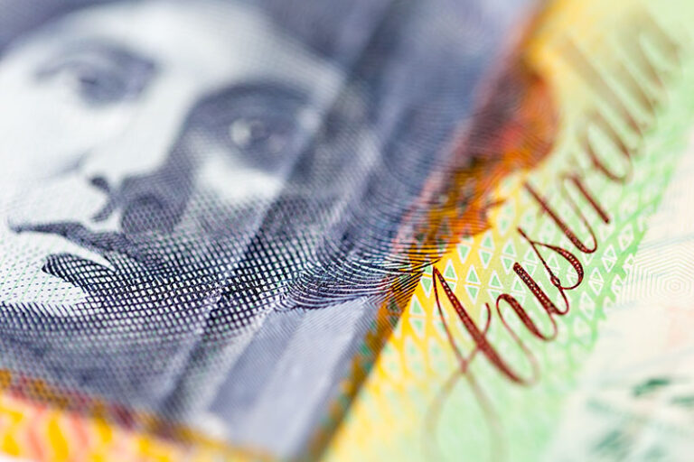 Australian dollar slightly rises as economic downturn signals emerge, despite challenges.